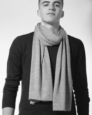 a man is wearing the aria large cashmere silk scarf around his neck|light