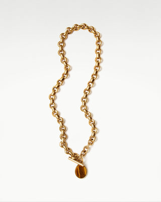 front view of the gold plated brass bembo egg necklace with tiger eye semi precious stone|light