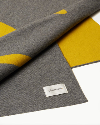 detailed view of the yellow double faced veritas wool blanket|light
