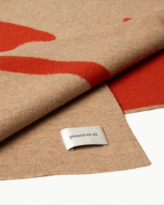detailed view of the orange double faced veritas wool blanket|light