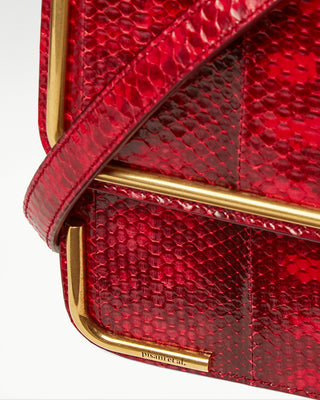 detailed view of the red gala exotic snake skin satchel bag|light
