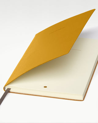 detailed view of the yellow octavo leather bound journal|light