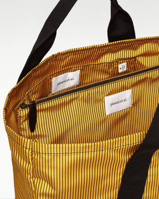 open view of the yellow pietro silk tote with zippered pouch|light