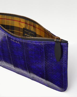 inside view of the blue vanni exotic snake skinpouch with a pocket |light