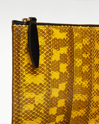 detailed view of the yellow vanni exotic snake skin zippered pouch|light