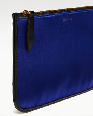 detailed view of the blue vanni silk zippered pouch with a pocket|light