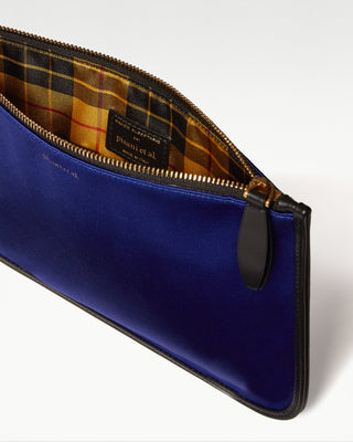 inside view of the blue vanni silk zippered pouch with a pocket|light