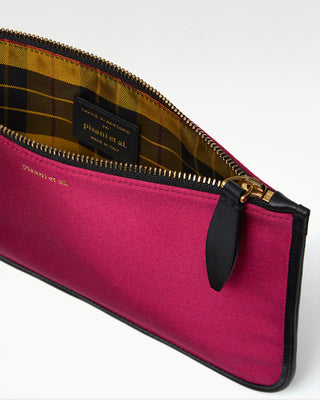 inside view of the pink vanni silk zippered pouch with a pocket|light