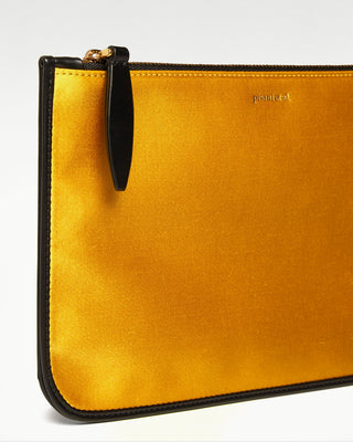 detailed view of the yellow vanni silk zippered pouch with a pocket|light