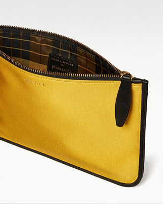 inside view of the yellow vanni silk zippered pouch with a pocket|light
