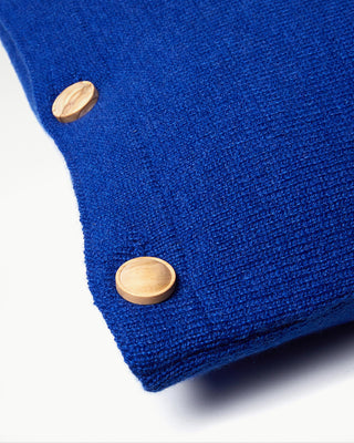 close up view of the blue small striped dolce cashmere travel pillow with olive wood buttons|light