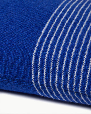 detailed view of the blue small striped dolce cashmere travel pillow with olive wood buttons|light