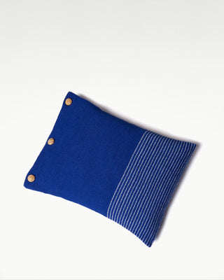 front view of the blue small striped dolce cashmere travel pillow with olive wood buttons|light