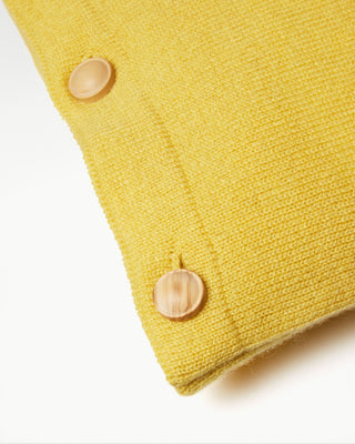 close up view of the yellow small striped dolce cashmere travel pillow with olive wood buttons|light