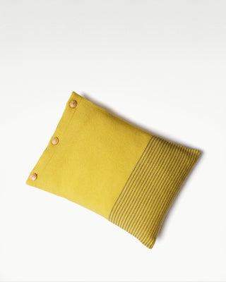 front view of the yellow small striped dolce cashmere travel pillow with olive wood buttons|light